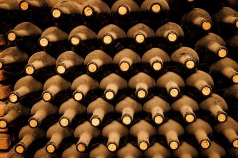A stack of wine bottles with cork stoppers Stock Photos