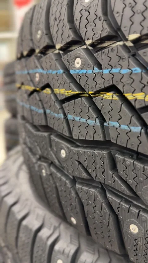 Stack of winter tires with intricate tread pattern, ideal for vehicle safet.. Stock Footage 320053274