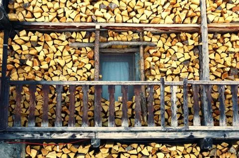 Stack of wood outside an old mountain house Stock Photos