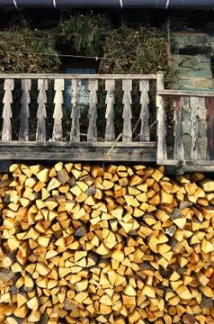 Stack of wood outside an old mountain house Stock Photos