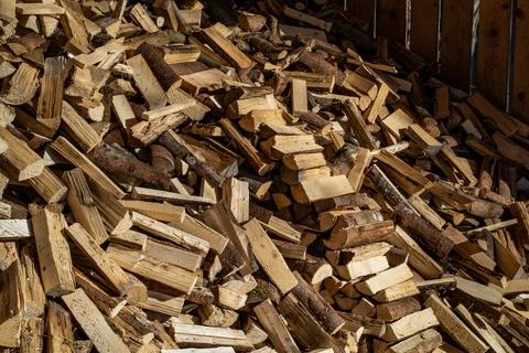 Stack of wood piled up in a hut Stock Photos