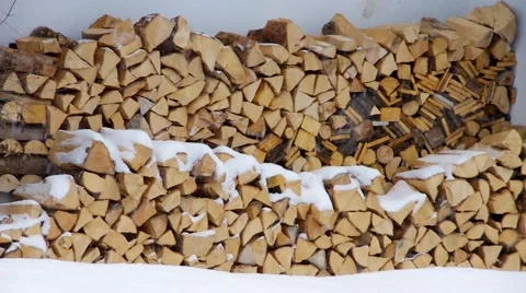 Stack of wood in snow Stock Footage 52112829