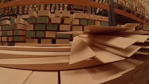 Stack of wood waiting to be used in the factory Stock Footage 129611143