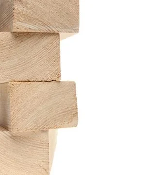 Stack of wooden 2x4s on white background with copy space. Stock Photos