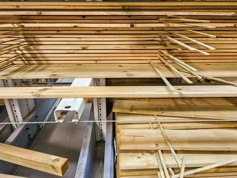 Stack of wooden bars. Pile of new wooden boards on a storage. 스톡 사진