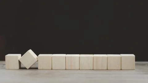 Stack wooden blocks on a dark background Stock Photos
