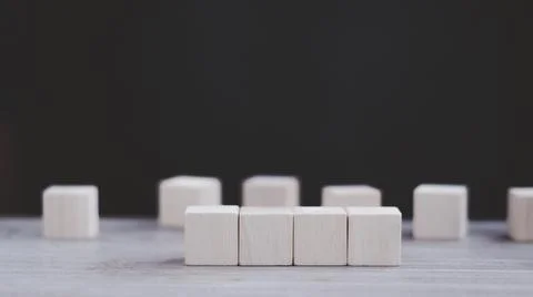 Stack wooden blocks on a dark background Stock Photos