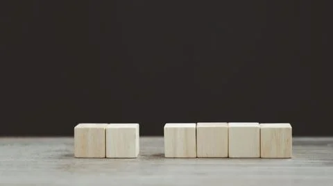 Stack wooden blocks on a dark background Stock Photos