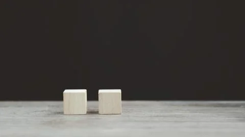 Stack wooden blocks on a dark background Stock Photos