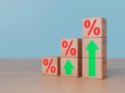 Stack of wooden blocks featuring red percent signs and rising green arrows 库存照片
