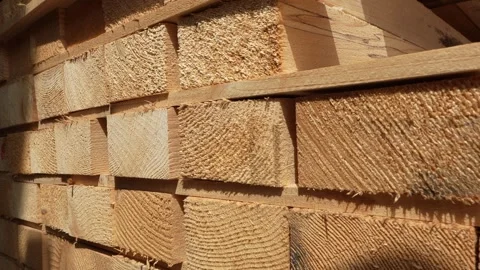 Stack of Wooden boards lumber beams, industrial wood pine timber at warehouse Stock Footage 243837010
