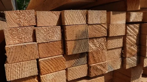Stack of Wooden boards lumber beams, industrial wood pine timber at warehouse Video stock 243837011
