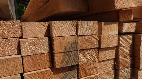Stack of Wooden boards lumber beams, industrial wood pine timber at warehouse Stock Footage 243837115
