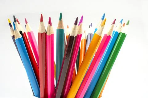 Stack of wooden colored crayons on white background Stock Photos