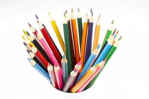 Stack of wooden colored crayons on white background Stock Photos