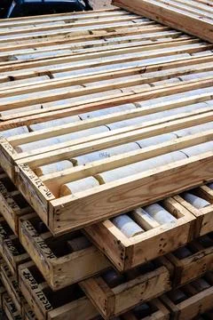 A stack of wooden crates with drill core rock in it Stock Photos