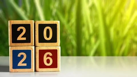 Stack of wooden cubes with the number 2026 on the table with blurred backgr.. Stockfoto's