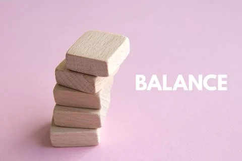 Stack of wooden cubes on pink background Stock Photos