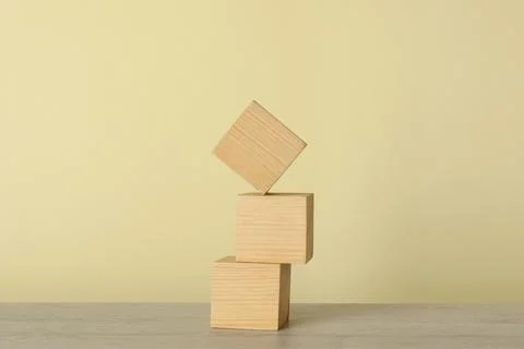 Stack of wooden cubes on table. Harmony and balance concept Stock Photos