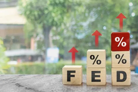 Stack of wooden cubes with the text of fed and percentage symbol with red a.. Stock Photos