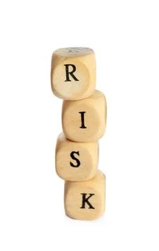 Stack of wooden cubes with word Risk isolated on white 스톡 사진