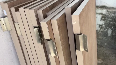 Stack of Wooden Doors for Construction Storage and Interior Design Concept Video stock 324609451