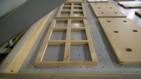 A stack of wooden facades is waiting for processing in the carpentry indust.. Foto stock