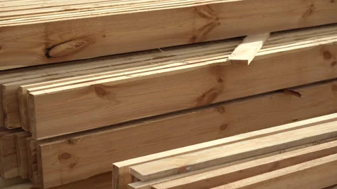 Stack of wooden planks at a construction site. Close-up. Construction of timber  Stock Footage 142446766