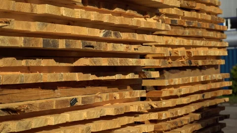 Stack of wooden planks in sawmill lumber yard. 4k footage. Stock Footage 255934086