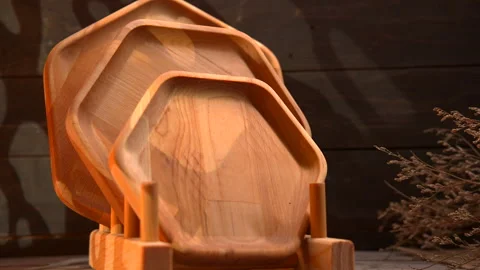 Stack of Wooden Plates on Table Stock Footage 273710273