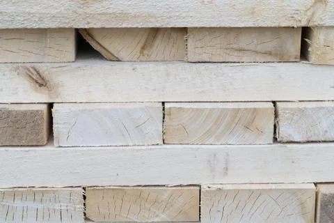 Stack of wooden squared beams for construction, texture Stock Photos