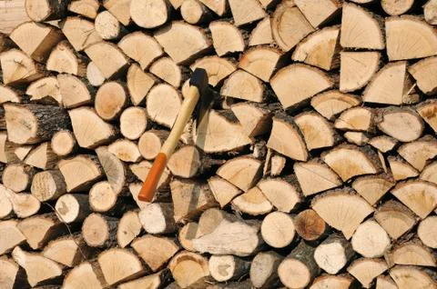 Stack of woods and axe Stock Photos