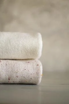 A stack of woolen things on the table Stock Photos
