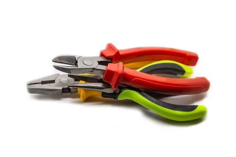 Stack of working electrician hand tools piled in a stack on an isolated backg Stock Photos