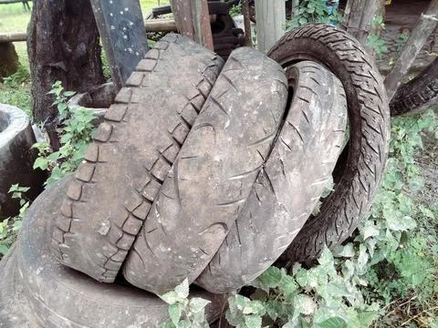 A stack of worn-out motorcycle tires Stock Photos