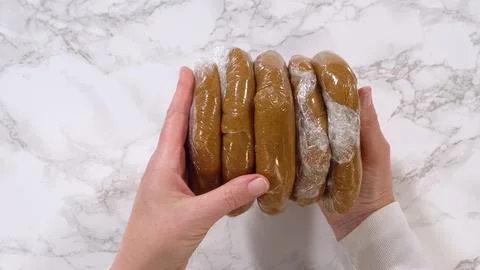 Stack of wrapped brown dough discs 写真素材