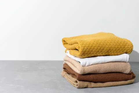Stack of yellow and beige clothes Stock Photos