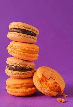 Stack of yellow and beige macaroons on a lilac background, Stock Photos