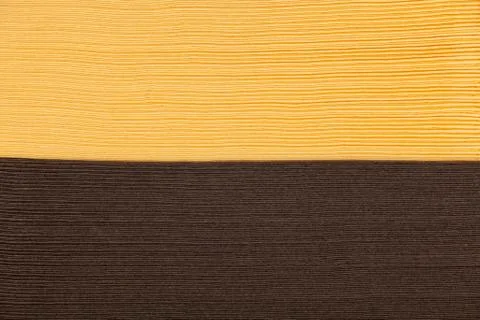 Stack of yellow and brown napkin paper closeup texture Foto stock