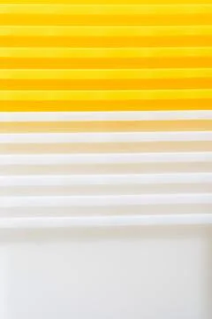 Stack of yellow and white recycled plastic containers 스톡 사진