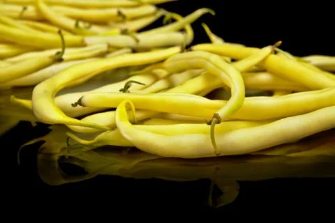 Stack of yellow beans on black background Stock Photos