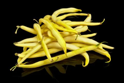 Stack of yellow beans in linen sack on black background Stock Photos