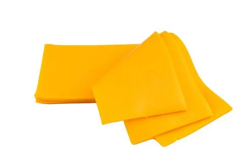 Stack of yellow cheese slices on white backdrop processed dairy ingredient .. Stock Photos