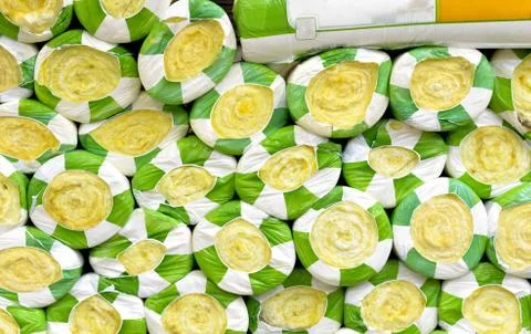 Stack of   yellow compressed and rolled mats made of mineral wool glass  in p Stock Photos