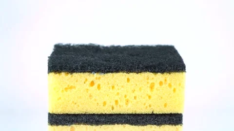 Stack of yellow dishwashing sponges isolated on white background Stock Footage 139114409