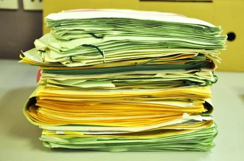Stack Of Yellow Folders On The Table Foto stock