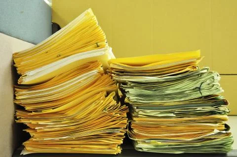 Stack Of Yellow Folders On The Table Foto stock