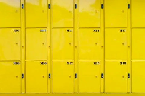 Stack of yellow lockers door at public locker service Stock Photos