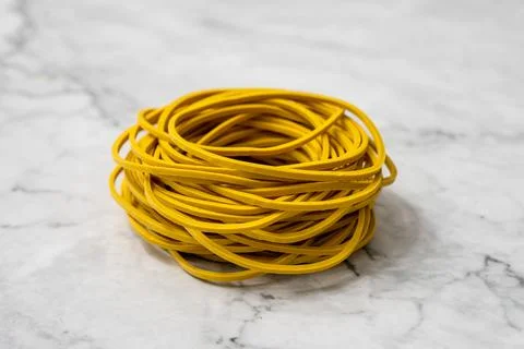 Stack of yellow rubber bands. Stock Photos