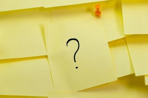 Stack of Yellow Sticky Notes with Question Marks Stock Photos